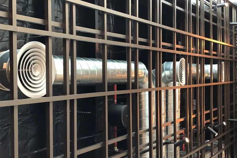 Close-up of hand sketching architectural construction drawings